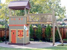 an outdoor play area with a swing set and climbing frame