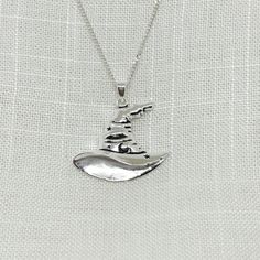 "Decorated with moon and stars, this super cute witch hat pendant is beautifully designed with the witch of today in mind.  These are approx 3cm (1.18 inches) long including the bale x 2.75cm (1.08 inches) wide.  It comes complete with a 20\" sterling silver chain.  All jewellery comes in a tarnish proof bag and gift box. There is a smaller sized necklace also available as well as matching drop or stud earrings on the website to buy separately." Halloween Pendant, Witchy Jewelry, Samhain, Pendant Silver, Witch Hat, Silver Jewellery, Sterling Silver Chains, Jewelry Crafts, Jewelry Necklace Pendant