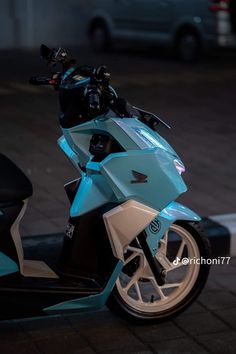 a motor scooter is parked on the street