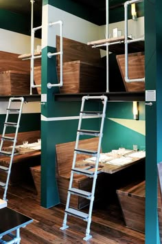 several ladders are attached to the wall in a restaurant