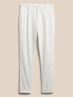 With quality this exceptional, ornamentation is carried away with the wind.  Here, a delightful blend of luxurious linen and soft cotton creates a style lightweight enough to make formalwear a breeze.  Belt optional--we designed this suit pant with a Elegant White Linen Pants, Elegant Linen Dress Pants For Spring, Elegant Linen Dress Pants For Summer, Elegant Summer Linen Dress Pants, Tailored White Cotton Dress Pants, White Tailored Cotton Dress Pants, Tailored White Linen Pants, White Cotton Dress Pants For Business Casual, Elegant Cotton Dress Pants For Summer