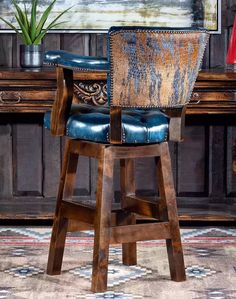 a wooden chair sitting in front of a desk with a plant on top of it