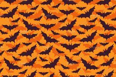 an orange and black background with lots of small bats on it's sides, all in