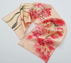 NEW! Finest apricot crush hand painted small silk scarf! Looking for a luxurious silk scarf to complete your outfit? Look no further than our collection of hand-painted silk shawls and scarves! Our designer women's shawls come in a variety of styles, from large silk shawl wraps to silk headwraps and shoulder wraps. Our flower scarf are perfect for a spring or summer wedding, while our hand-painted shawls and scarves add a unique touch to any outfit. Made from only the finest materials, our silk Silk Scarf With Floral Print For Gift, Silk Scarves With Floral Print For Gift, Silk Scarves With Floral Print As Gift, Silk Floral Print Scarf As Gift, Handmade Pink Silk Scarf, Red Floral Print Silk Scarf As Gift, Red Floral Print Silk Scarf As A Gift, Handmade Red Silk Scarf For Gift, Silk Scarf As A Gift