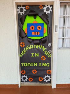 a door with an advertisement on it that says programme is in training and gears