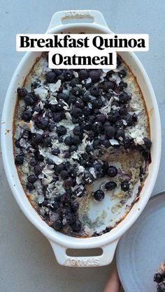 a white dish filled with baked oatmeal topped with blueberries