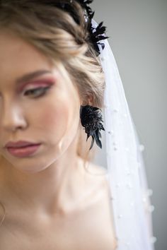 Black flower earrings. The flower earrings are made of preserved Ruscus leaves and other arranging material. Matching headpiece: https://www.etsy.com/uk/listing/1159358077/black-flower-crown-black-wedding?click_key=88077da76150a9e5318e7872a4831787a5d54489%3A1159358077&click_sum=3ae0135e&ref=shop_home_active_1 When stored in dry and dark place, our products last 10-15 years. We can also make you other matching accessories. Please message me for more information. :) ------------------------------- Black Wedding Earrings, Black Flower Wedding, Black Flower Crown, Black Jewellery, Flower Headpiece Wedding, Wedding Earrings Studs, Gothic Bride, Earrings Gothic, Crown Black