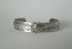 Bat Cuff Bracelet This beautiful silver plated cuff bracelet has a silver plated bat design. Adjustable. Half inch wide. Gothic Jewelry Bracelets, Goth Wishlist, Vampire Bracelet, Goth Bracelets, Vampire Jewelry, Goth Gifts, Goth Vampire, Gothic Bracelet, Bat Design