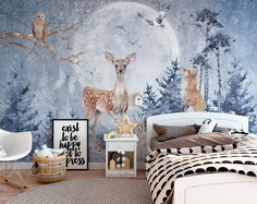 a bedroom decorated with deer and birds in the night time wallpaper, along with a bed