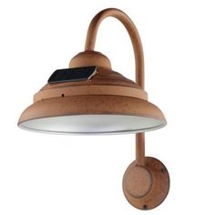 an outdoor wall light with a solar panel on the top and a circular wooden arm