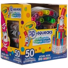 a box of crayons markers and pens with the packaging in front of it