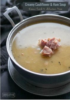 creamy cauliflower and ham soup in a silver bowl on a black tablecloth