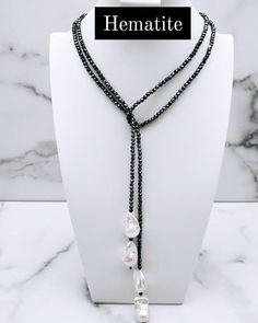 Dark hematite with large baroque pearls bolero lariat necklace 50 inch strand of dark hematite with two baroque pearls on each end. Wear as an elegant scarf or belt! AA grade pearl quality Everything is customizable, just message us! Made to order, 1-2 weeks processing time Handcrafted in Houston, Texas Shipping in the US only Follow us on Instagram! @mochimochi_htx Elegant Beaded Hematite Necklace, Elegant Lariat Necklace With Faceted Beads, Elegant Scarf, Beaded Scarf, Elegant Scarves, Scarf Necklace, Lariat Necklace, Houston Texas, Baroque Pearls