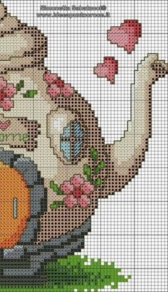 a cross stitch pattern with an image of a baby in a diaper holding a teddy bear