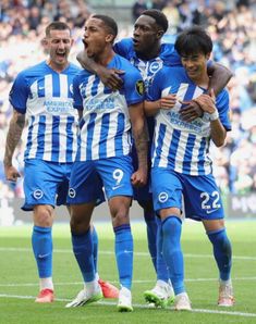 the soccer players are celebrating on the field