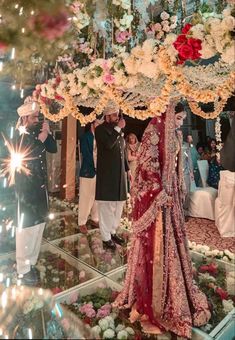 the bride and groom are getting ready to walk down the aisle at their wedding ceremony