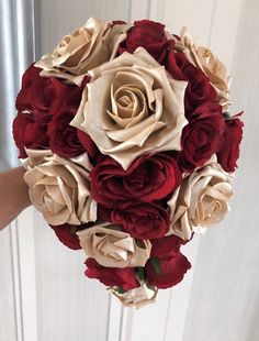 a bridal bouquet with red and white flowers