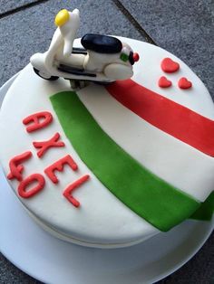 a birthday cake with a toy car on top