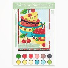 the paint by number kit includes an image of a cake with cherries on it