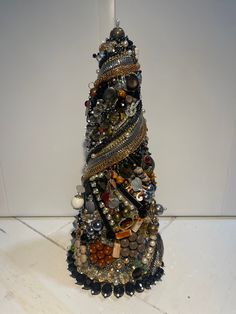 a christmas tree made out of buttons and beads