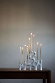 a group of candles sitting on top of a wooden table