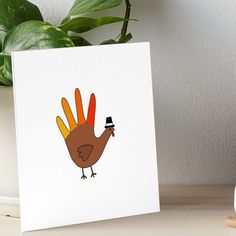 a card with a turkey holding a hat on it's head and wearing a top hat