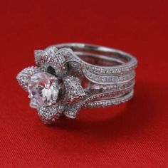 a close up of a ring on a red surface