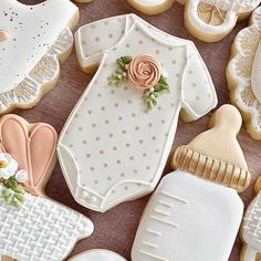 baby shower cookies are arranged on a table