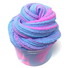 a cup filled with blue and pink yarn