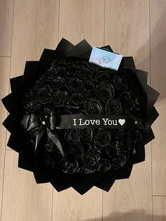 a black box with roses in it that says i love you