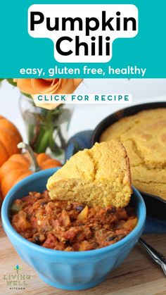 pumpkin chili in a blue bowl with a spoon scooping out some food from it