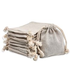 pack of 50 burlap bags with pom poms on each side for storage