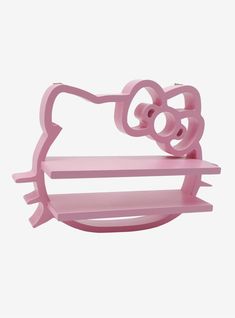 a pink hello kitty shelf is shown against a white background