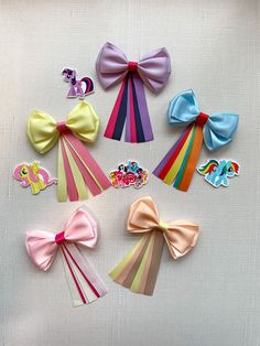 "If your little one is my little pony lover, we get it. Make any day feel a bit more magical with our character-inspired hair bows. This super cute design features the signature colors of your favorite cartoon friends. It's perfect for every occasion, from everyday wear to dressing up at parties. Made with a simple hair clip closure that is secure enough to hold her bangs out of her eyes during play, all without tugging too tightly on her locks. To order, simply select your little one's favorite Character Hair Bows, Cartoon Friends, Disney Hair Bows, Disney Hair, Toddler Bow, Simple Hair, Bow Tutorial, Toddler Bows, Baby Bow