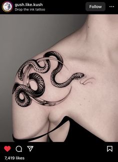 a woman's shoulder with a snake tattoo on it