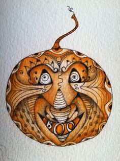 a drawing of a pumpkin with an animal's face in the center and eyes on it