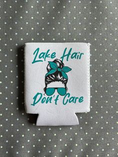 a patch with the words lake hair don't care on it and a green bow