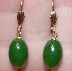 Quality 14k gold filled 15mm natural green oval jade leverback earrings aaavintage  gorgeous  handmade pair of 14k  gold filled                          quality green jade lever back  earringsa++++++ apple green jade length of  green jade oval stones: 15 mmfrom top to bottom 36 mvintage 1950'severy pair is a bit different based on the nature of jadessee photos.gorgeous coloring on these jadesvery cool looking.you will love wearing them Green Oval Earrings For Formal Occasions, Green Oval Earrings For Anniversary, Green Oval, Leverback Earrings, Oval Stone, Emerald Jewelry, Jade Green, Fun Earrings, Cultured Pearls