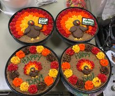 four cakes decorated to look like turkeys with happy thanksgiving written on them