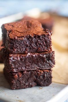 chocolate brownies stacked on top of each other