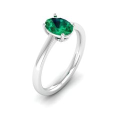 This elegant ring features a stunning oval emerald stone set in lustrous white gold. The vibrant green hue of the emerald is beautifully complemented by the brilliance of the white gold band, creating a timeless and sophisticated piece of jewelry. Metal: 14K Gold Setting Type: Prong Rhodium Finish: Yes, on White Gold Gemstone Details: Gemstone: Emerald Shape: Oval Average Dimensions: 8.00 x 6.00 MM Quantity: 01 Average Cut: Very Good Average Color: Medium to Dark Green Average Clarity: Eye Clean Oval Tsavorite White Gold Ring, Oval Tsavorite Ring In White Gold, Oval Brilliant Cut Emerald Ring, Classic Oval Tsavorite Emerald Ring, Oval Brilliant Cut Emerald Ring In White Gold, Classic Green Emerald Oval Cabochon Ring, Modern Oval Brilliant Cut Emerald Ring, Classic Green Oval Cabochon Emerald Ring, Oval Emerald Birthstone Ring In White Gold