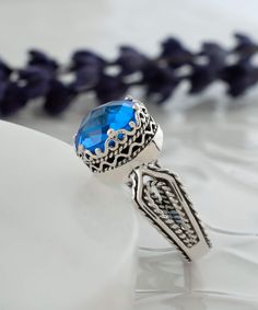 Looking for a stunning gift for your girlfriend, wife, mother, or sister? Look no further than this gorgeous silver filigree art women's cocktail ring, featuring intricate details and a beautiful face-up design. With a double-side faceted checkerboard round-cut blue quartz gemstone measuring 10 mm and a face size of 0.47" / 12.00 mm, this ring is sure to turn heads. This stunning piece comes with a velvet pouch, silver polish cloth, and a luxurious gift box, making it an ideal choice for birthda Ornate Filigree Ring For Promise, Ornate Filigree Promise Ring, Sapphire Sterling Silver Filigree Gift Ring, Sapphire Sterling Silver Filigree Ring Gift, Blue Filigree Ring Fine Jewelry Gift, Sterling Silver Sapphire Filigree Ring Gift, Blue Filigree Ring As Fine Jewelry Gift, Blue Filigree Ring As A Gift, Sapphire Filigree Ring With Intricate Design For Gift