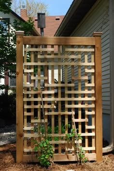 a wooden trellis in front of a house