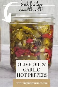 a mason jar filled with sliced jalapeños and thai red chilies in olive oil and garlic Canned Hot Peppers Recipes, Hot Pepper Oil Recipe, Pickling Hot Peppers Recipe, Peppers In Oil, Canning Hot Peppers, Garden Vegetable Recipes, Best Fridge, Pickled Hot Peppers, Hot Pepper Recipes