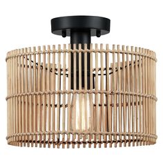 the bamboo light fixture is hanging from the ceiling, and it has a round wooden cage with