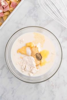 ingredients in a glass bowl on a marble counter top