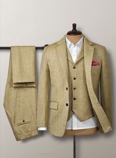 Aim for a lavish take on a casual style with our Highlander Heavy Beige Herringbone Tweed Suit. Most significantly, crafted from a pure wool material expresses a thick, decently rugged and gorgeously soft texture with a distinctive herringbone weave over a brown hue. Additionally, the cloth exudes an enormously cozy vibe, which makes this suit an excellent investment for the winter. Primarily, the precise tailoring suit frames the contour and ensures you look sharp for a charming profile while conducting business or attending a social occasion.  Look Includes  Highlander Heavy Beige Herringbone Tweed Fabric  Two Button Jacket Style  Notch Lapel   Horn Brown  Buttons  Single Vent  Three Cuff Buttons  Two Welted Back Pockets on Trousers   Click 'Customize Now' to modify the look if needed. Beige Tweed Business Jacket, Beige Tweed Jacket For Business, Business Beige Tweed Jacket, Fitted Wool Tweed Jacket With Suit Collar, Beige Tweed Jacket With Welt Pockets, Elegant Tweed Three-piece Suit With Notch Lapel, Elegant Fitted Tweed Three-piece Suit, Fitted Tweed Suit With Long Sleeves, Classic Tweed Suits With Pockets