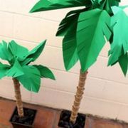 two paper palm trees sitting on top of each other