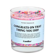 a candle with confetti on it that says congrats on that thing you did