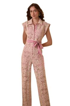 Pink floral laced jumpsuit with handcrafted cloth buttons and scalloped edge on the leg opening. Comes with a separate tie-belt with lace edge. - Aza Fashions Elegant Lace Jumpsuits And Rompers For Spring, Fitted Jumpsuits And Rompers With Lace Trim For Spring, Elegant Sleeveless Jumpsuits And Rompers With Lace Trim, Elegant Spring Jumpsuits And Rompers With Lace Trim, Elegant Sleeveless Lace Trim Jumpsuits And Rompers, Elegant Sleeveless Lace Trim Jumpsuits, Elegant Summer Jumpsuits And Rompers With Lace Trim, Cloth Buttons, Jumpsuit With Belt